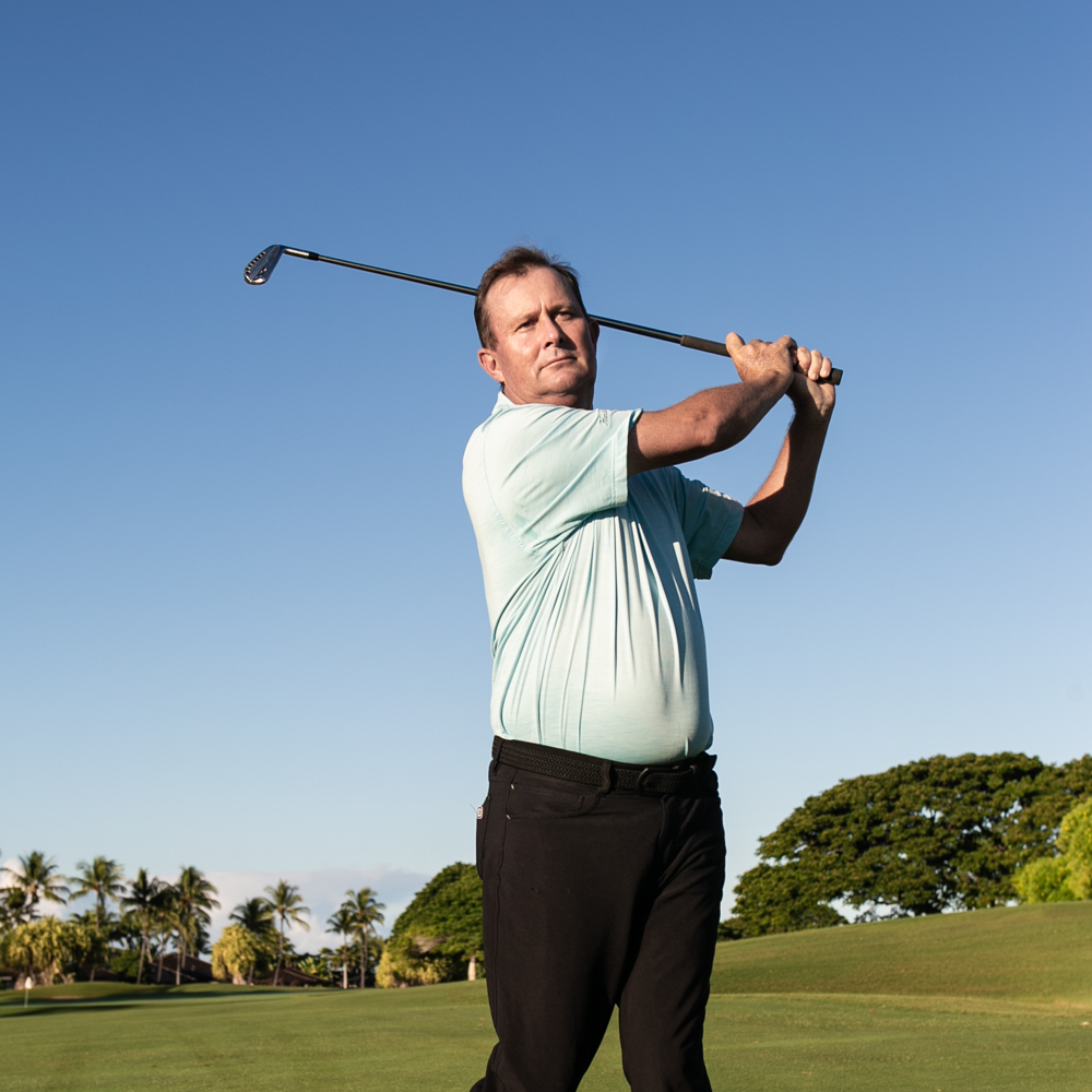 Golf pro Brendan Moynahan swinging golf club