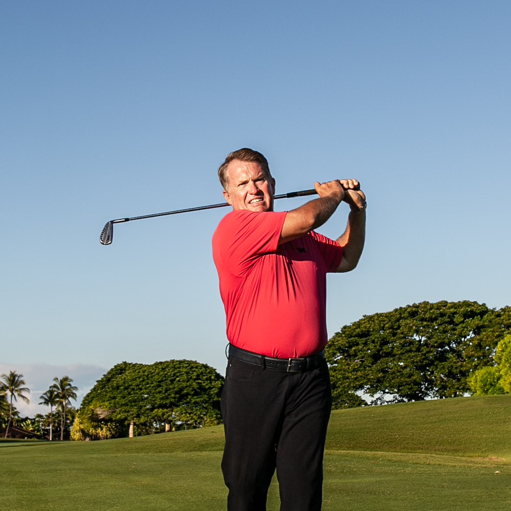 Golf pro Scott Bridges swinging golf club